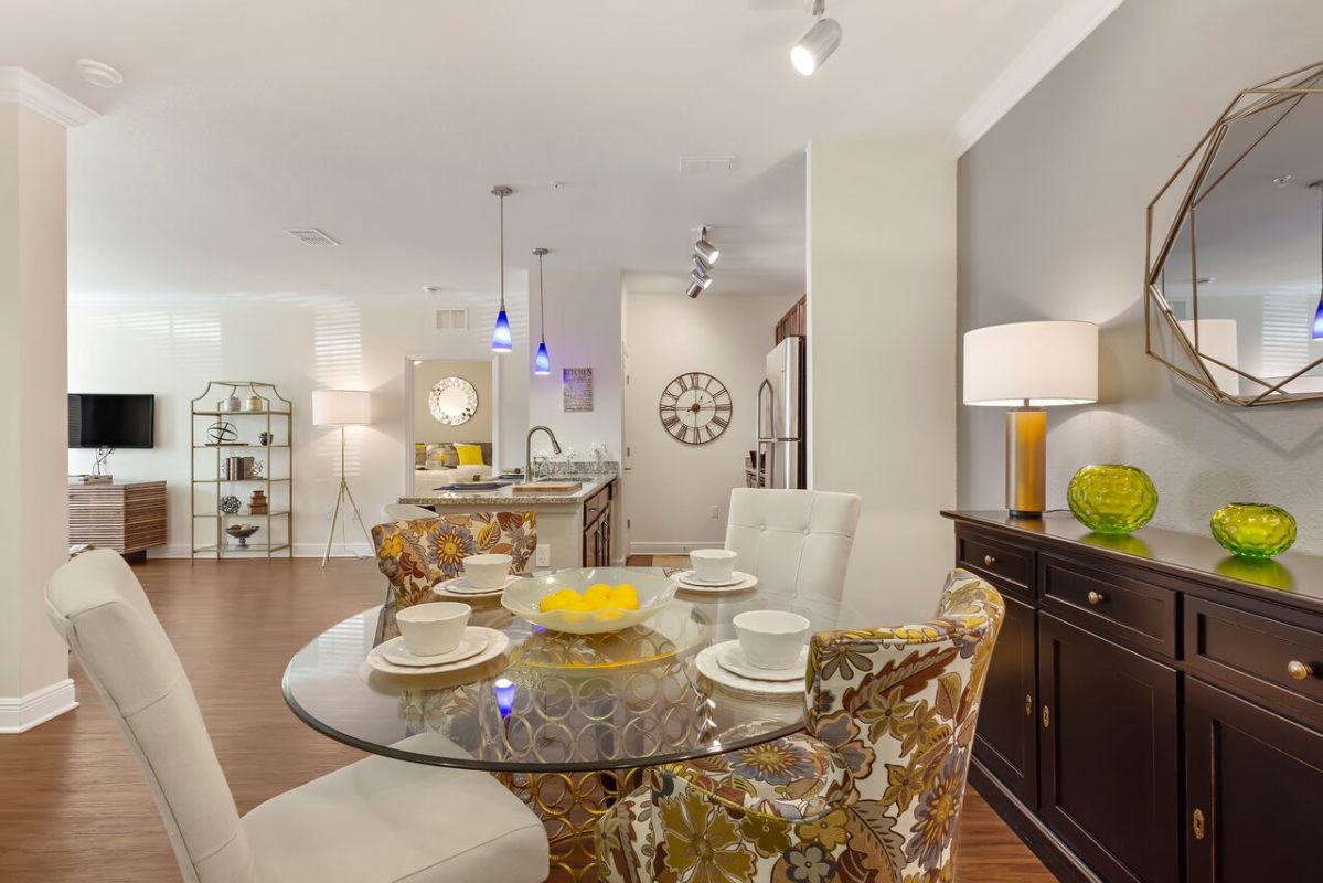 Luxury unit that features open concept kitchen and living area with island seating, dining area